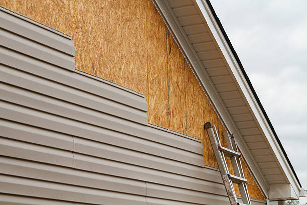 Professional Siding Repair technician working in Uhrichsville, OH